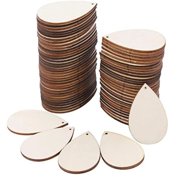 Unfinished Wood Earrings: Laser cut wooden drop pendants for DIY jewelry making, stacked in bulk for wholesale.