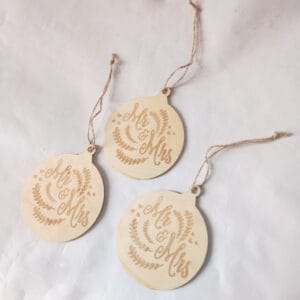 Wholesale 3 Pcs Wooden Christmas Tree Ornaments: Set of three ball-shaped, laser-engraved wood ornaments with "Mr & Mrs" design. Perfect Christmas tree decorations.