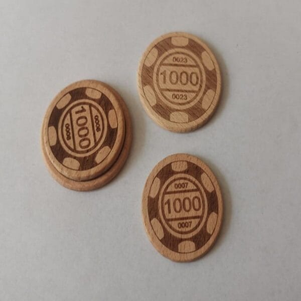 Four beech wood game coins, each inscribed with "1000," are displayed—two stacked and two lying separately—on a plain white background.