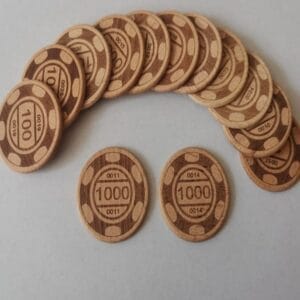 A set of beech wood coins featuring poker values of 100, plus two separate wooden tokens valued at 1000, arranged on a white surface. Custom Printed Tokens.