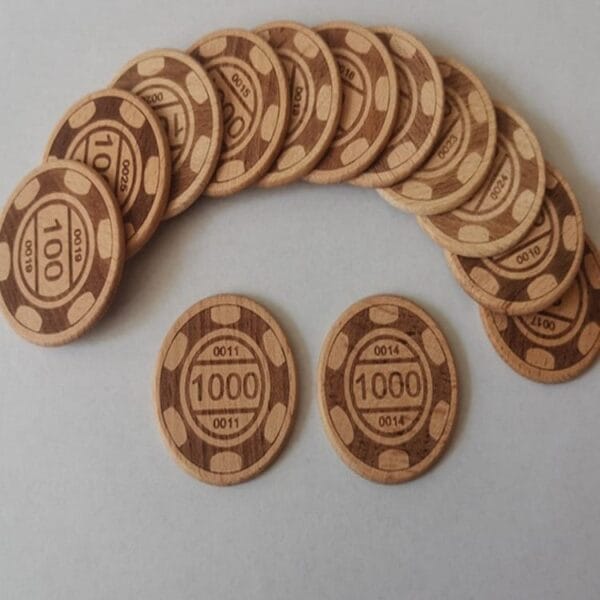 A set of beech wood coins featuring poker values of 100, plus two separate wooden tokens valued at 1000, arranged on a white surface.