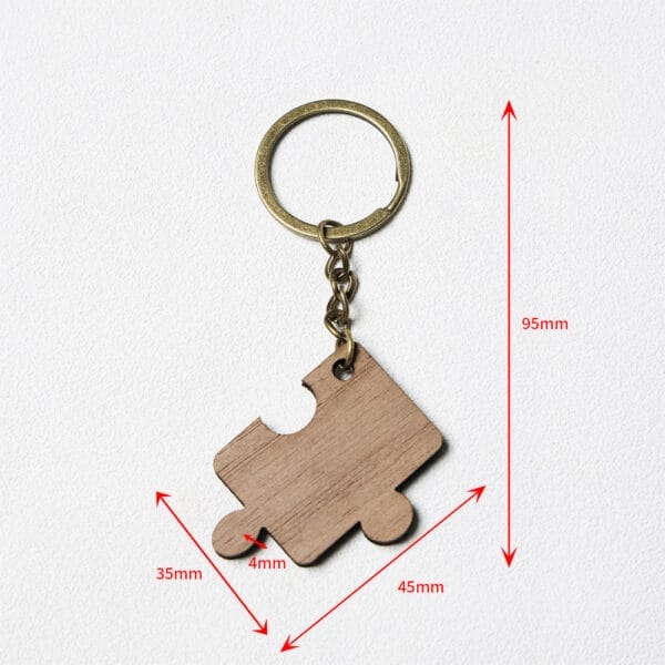 Keychain with a wooden puzzle piece pendant, showing measurements: 95mm total length, pendant 45mm wide, 35mm tall, and 4mm thick, on a white background.