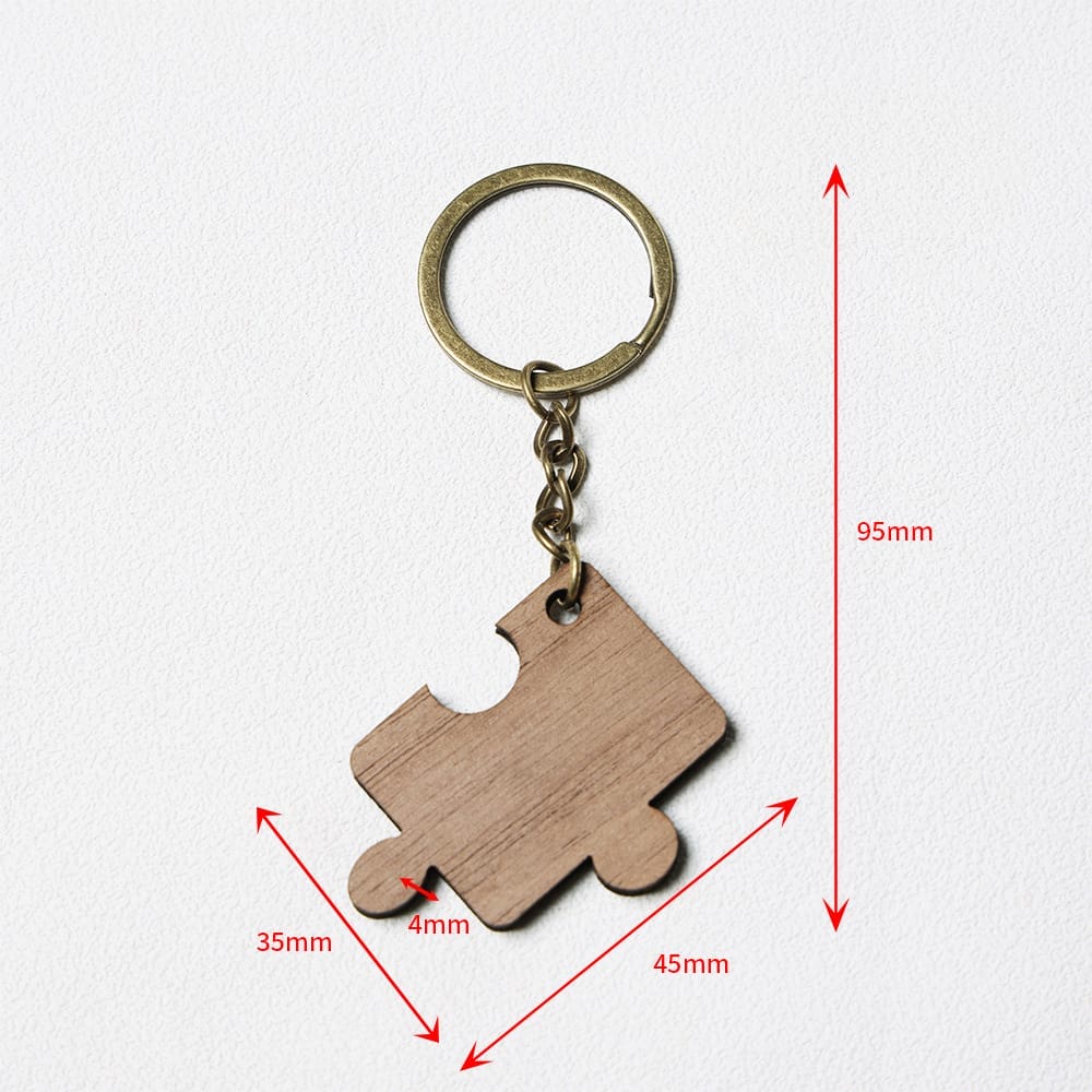 Keychain with a wooden puzzle piece pendant, showing measurements: 95mm total length, pendant 45mm wide, 35mm tall, and 4mm thick, on a white background.
