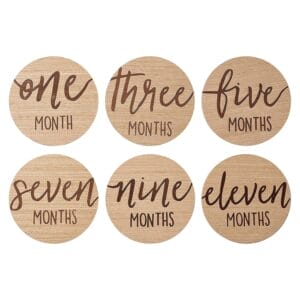 Custom Wholesale Wooden Discs: Baby milestone month cards, engraved with "one", "three", "five", "seven", "nine", "eleven" months.