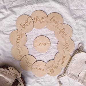 Baby's first year milestone markers: Set of twelve wood round crafts for recording monthly growth