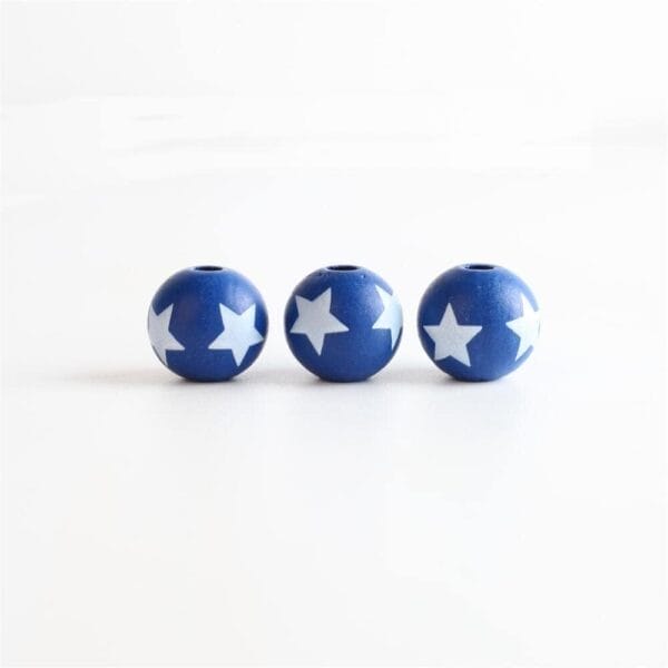 July 4th Patriotic Wooden Beads Bulk: Blue star print spacer beads for DIY jewelry and garland crafts.