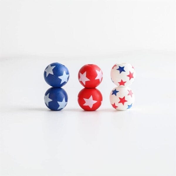 July 4th Patriotic Wooden Beads Bulk: Red, white, and blue star print spacer wooden beads in bulk for DIY jewelry and garland.
