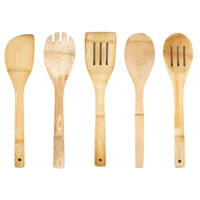 Five wooden kitchen spoons, including wooden kitchen spoons, a spatula, and a fork, are arranged upright in a row against a white background.