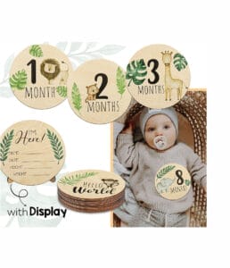 Eco-friendly baby milestone wooden pieces with jungle animal designs. Includes monthly markers and "Hello World" piece.