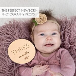 Round wooden milestone marker for baby photos. "Three months" is engraved on the wood.