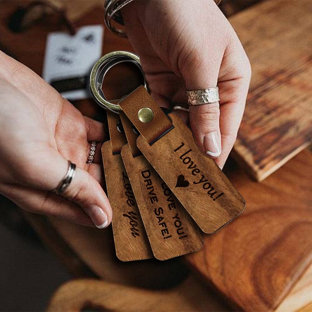 Wooden keychains with "I love you!" engravings. Custom laser-cut wooden keychains available wholesale.