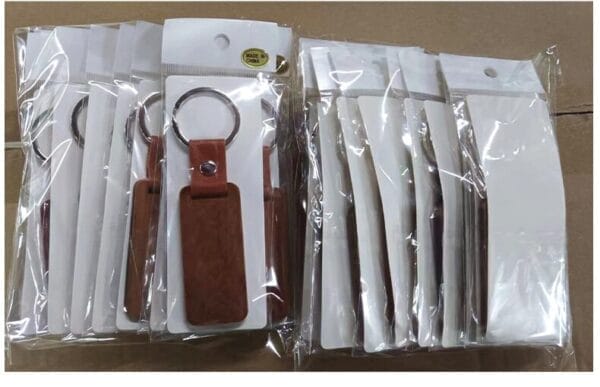 Packaged wooden keychains. Wholesale Wooden Keychains Manufacturer, custom laser-cut supplier.