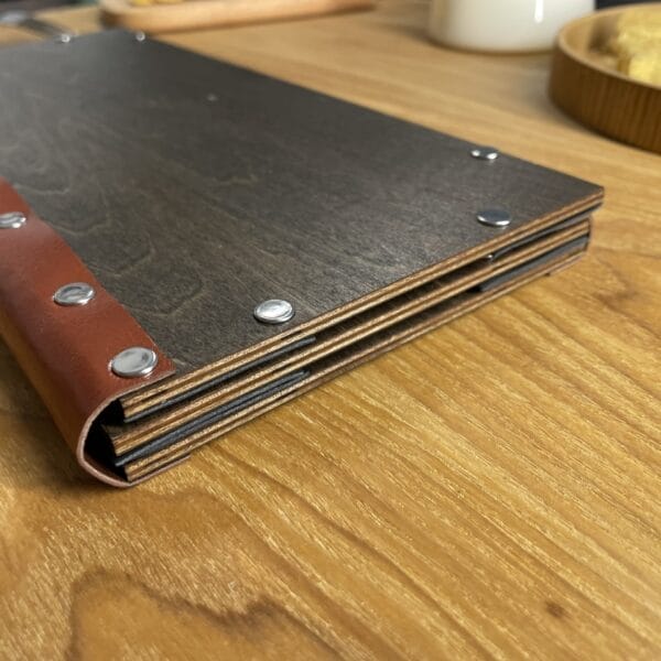 High-quality wooden menu cover with brown leather accents. Wholesale restaurant price list.