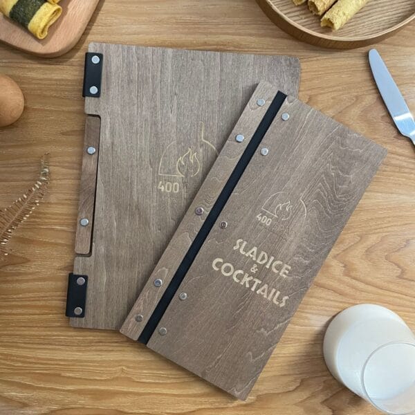 Wooden menu covers with "SLADICE & COCKTAILS" and "400 GRAD" engraved. Wholesale restaurant price lists.