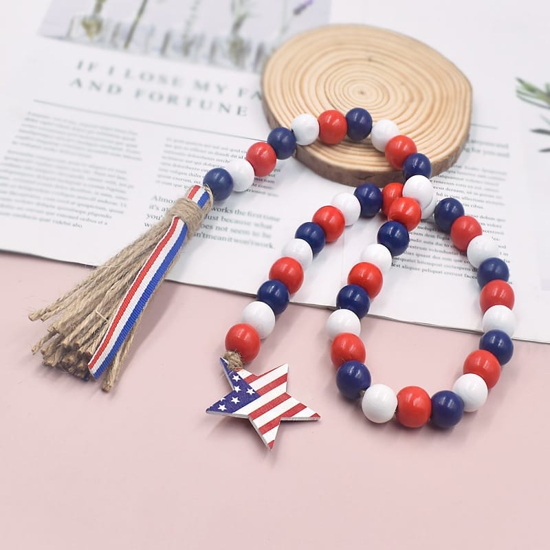 Patriotic beading wood garland with star charm. Red, white, and blue beads.