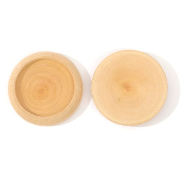 Two round, unfinished wooden discs are displayed side by side; one is a flat Eco-friendly Needle Base, while the other features a recessed center perfect for use as a Wood Needle Holder.