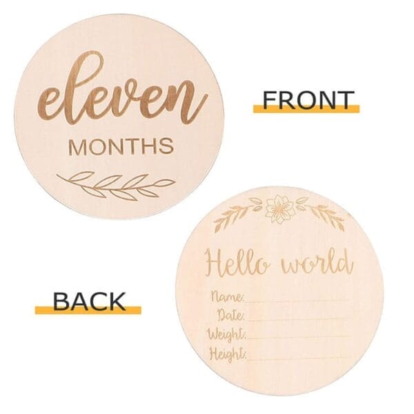 Two round wooden milestone cards: the front reads "eleven months" with a leaf design, and the back is customized with fields for name, date, weight, and height alongside a floral motif. Perfect as wood baby photo props for precious memories.