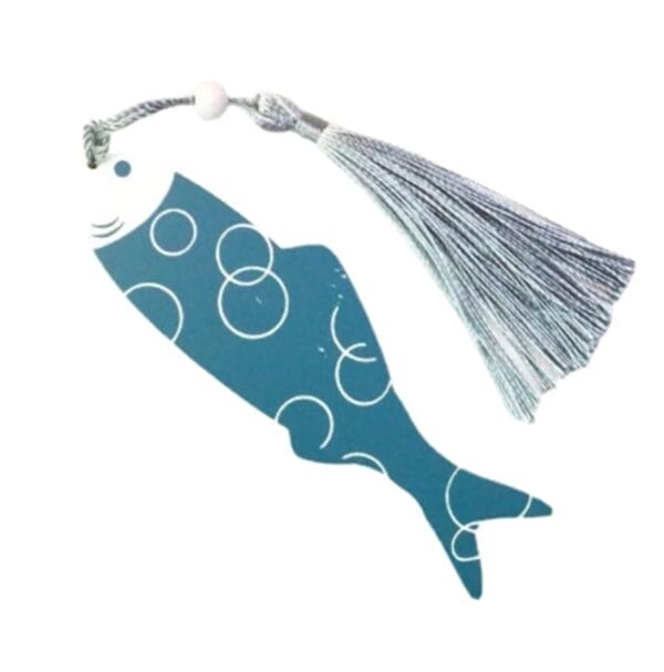 A fish-shaped custom wooden bookmark featuring white circular patterns and a silver tassel attached to the top.