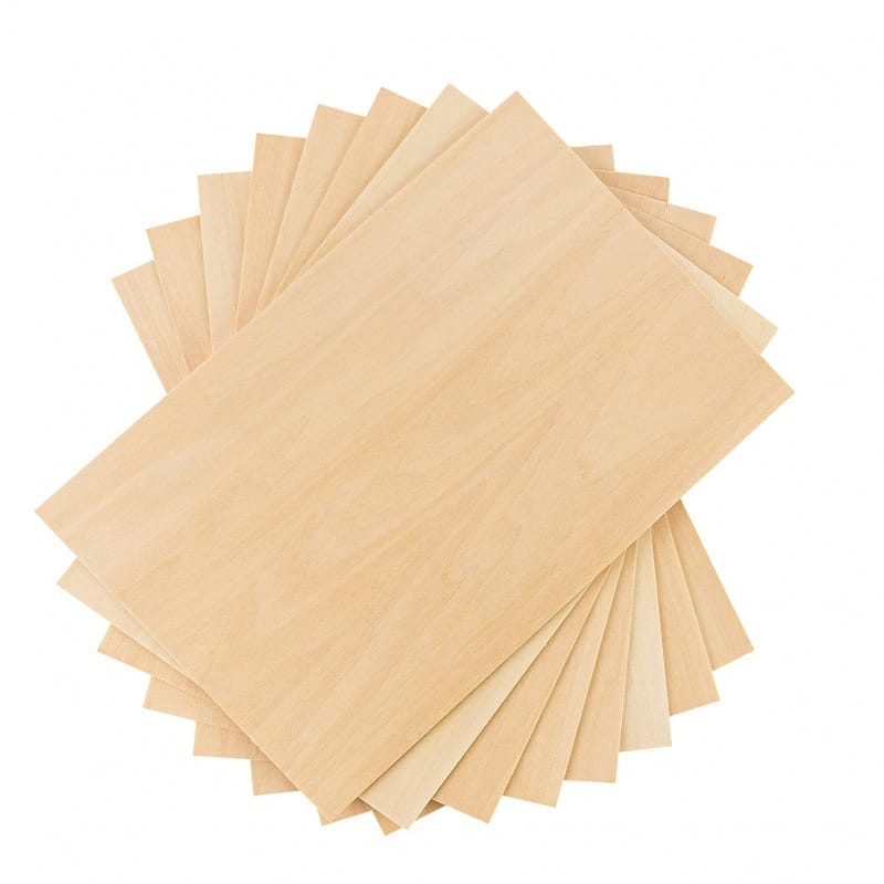 A stack of cut out wood veneer sheets in light tones is arranged in a fanned-out pattern against a white background.