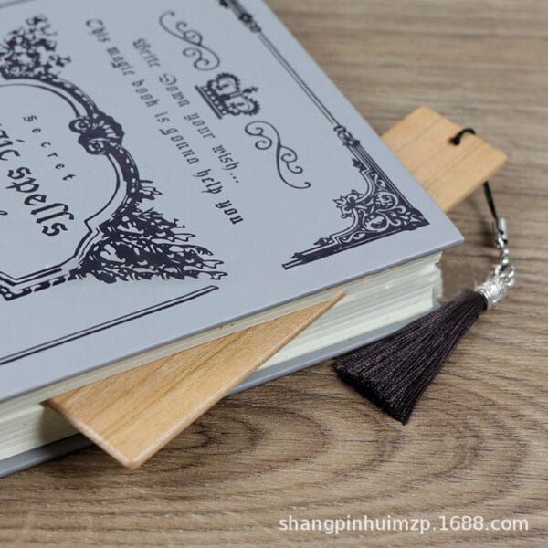 Wooden bookmark in gray magic book; custom engravable bookmark for distribution.
