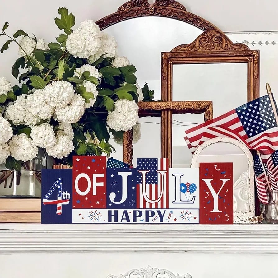 Patriotic "4th of July Happy" wooden block sign with American flags and hydrangeas.