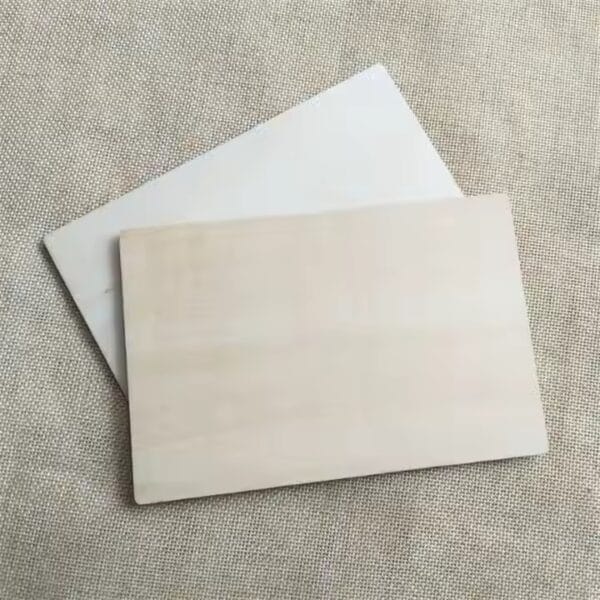 Two laser-cut business card blanks, ready for customization. Wholesale supplier of custom blanks.