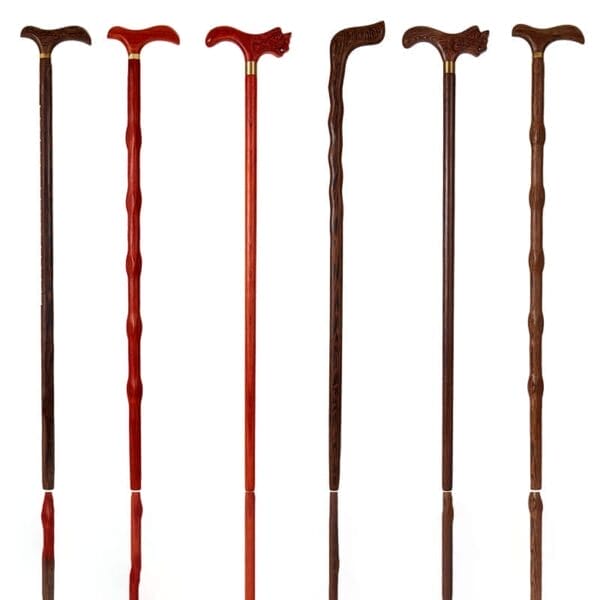 Six wooden walking canes, each crafted from long stick wood with curved handles, are displayed upright on a white background. The canes vary in color, texture, and handle shape.