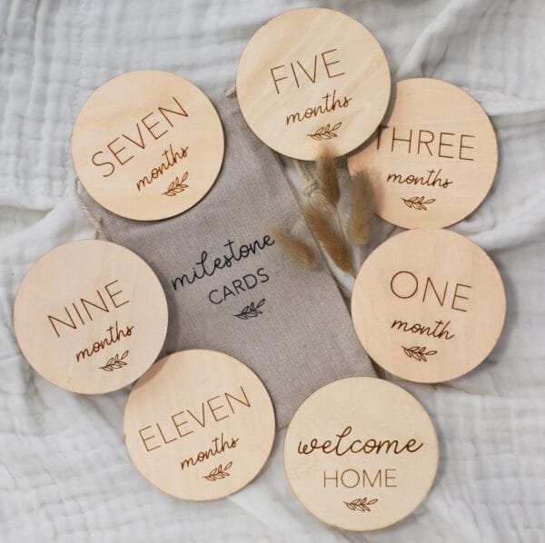 Wooden milestone cards for baby's first year. Numbers one through eleven, plus "Welcome Home". Wholesale available.
