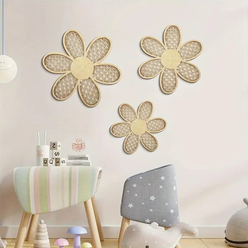 Three woven rattan flower wall decorations add Bohemian wall decor flair above a pastel chair and gray star-patterned chair in a playful children’s room filled with toys and blocks.