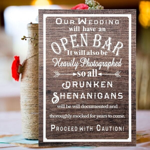 Rustic wooden wedding sign: "Open Bar. Heavily Photographed. Proceed with Caution!" Custom wood bar menu.
