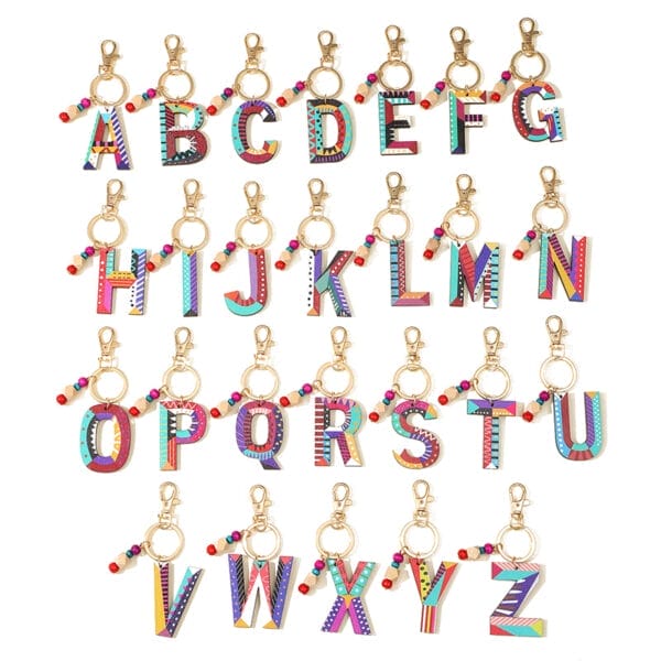 26 alphabet keychains; wholesale wood bead keychains with vacation style designs.