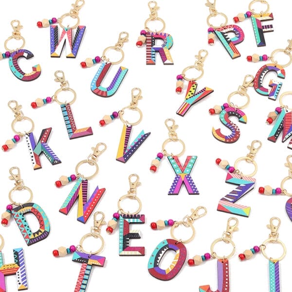 Colorful wooden alphabet keychains with beads. Wholesale vacation-style letter keyrings.