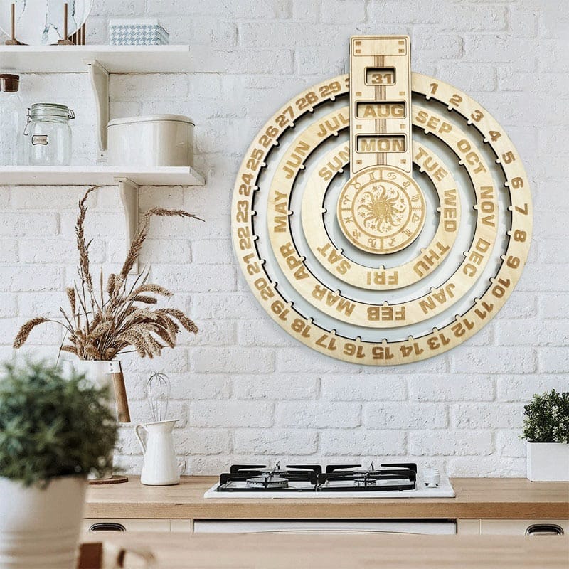A modern kitchen with a white brick wall features a large circular wood calendar, perfect as wall decor, above a gas stove and countertop with dried flowers in a vase from your favorite wooden craft supplier.