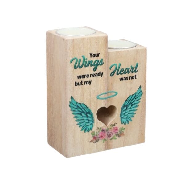 Two wooden candle holders with teal wing designs, floral accents, and the text: "Your wings were ready but my heart was not." Perfect for those seeking custom wood candle holders from a trusted wood candle holder manufacturer.