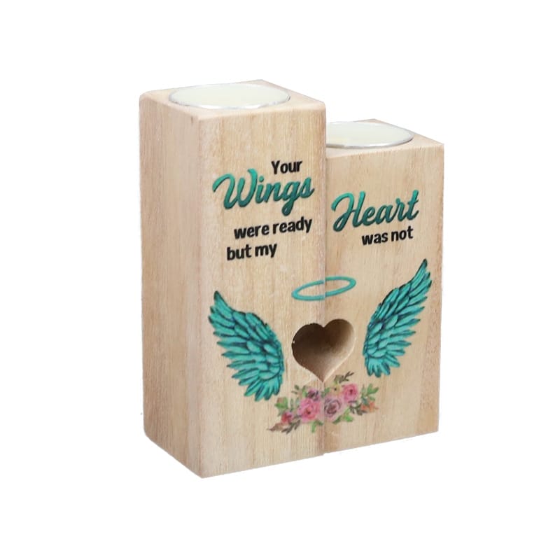 Two wooden candle holders with teal wing designs, floral accents, and the text: "Your wings were ready but my heart was not." Perfect for those seeking custom wood candle holders from a trusted wood candle holder manufacturer.
