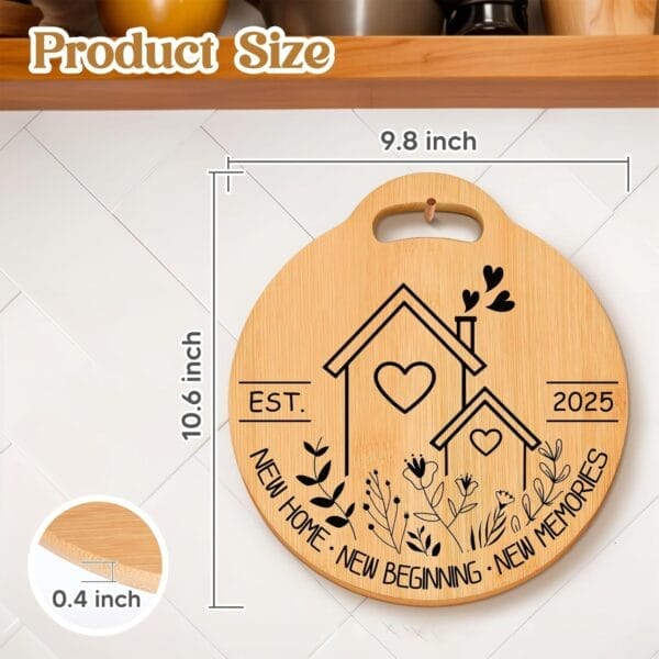 Round laser engraved cutting board with house designs, floral accents, and "EST. 2025 NEW HOME · NEW BEGINNING · NEW MEMORIES." Measures 10.6" x 9.8" x 0.4". Crafted by a quality wood cutting board manufacturer.