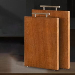 Two stacked acacia wood cutting boards with stainless steel handles. Bulk wood cutting boards.