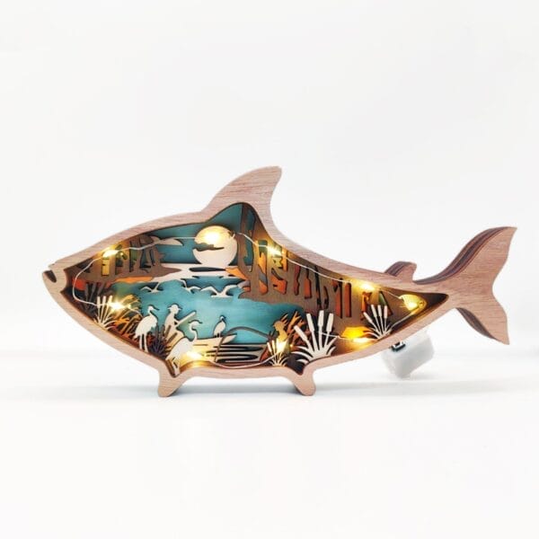 Laser-cut wood decor shark nightlight with coastal scene. Wholesale wood decor.