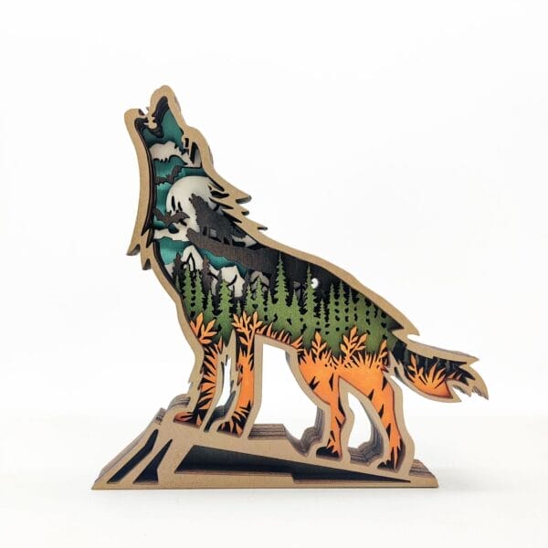 Laser-cut wooden wolf howling at the moon, layered design showing forest scene. Wholesale wood decor.