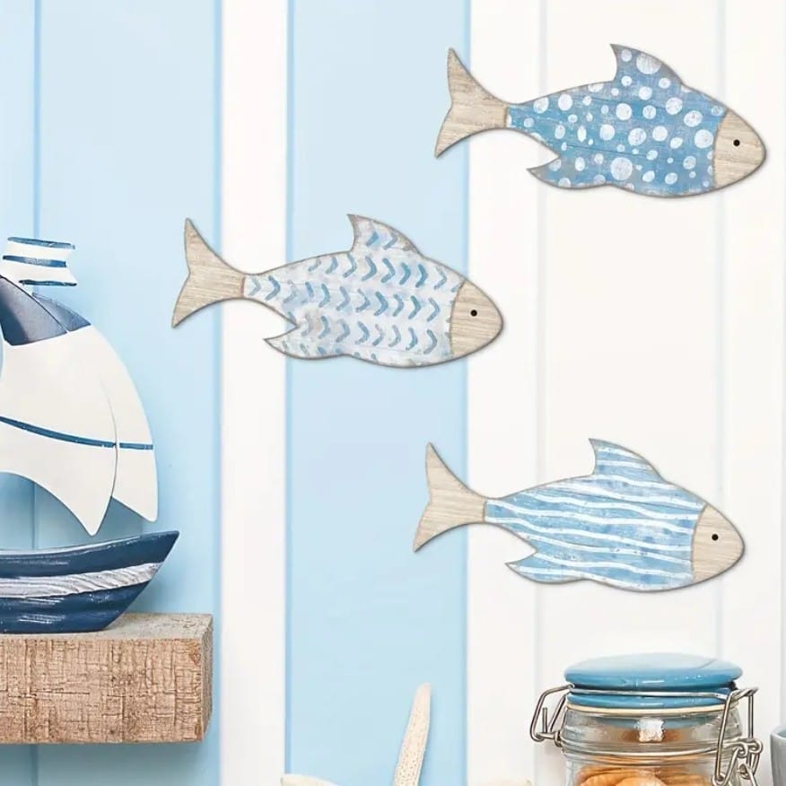 Three blue and white wooden fish wall decorations