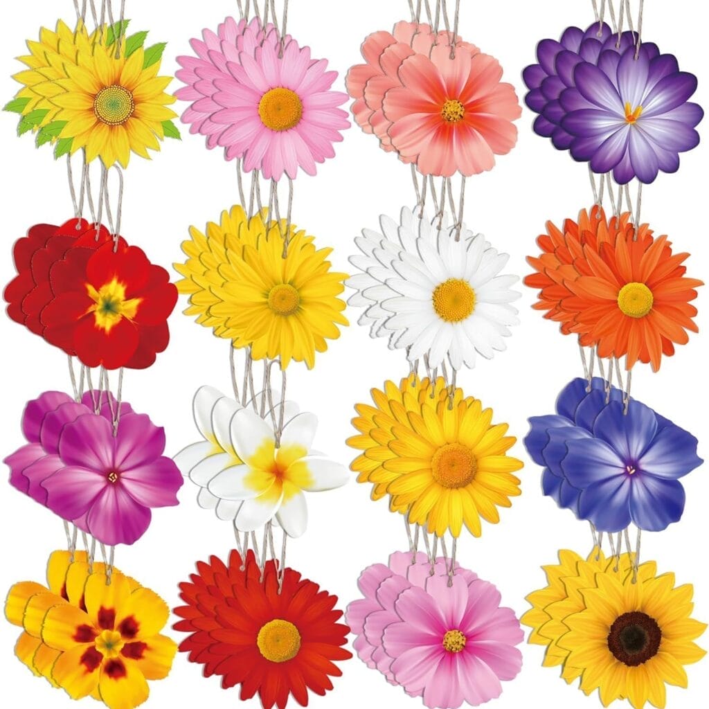 Four strings of assorted colorful paper and wood flowers hang vertically, each string displaying different flower shapes and colors including yellow, pink, purple, white, red, and orange.