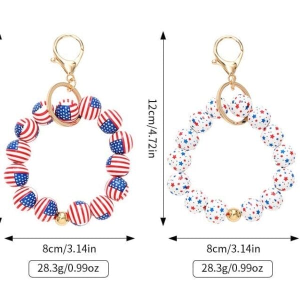 Two custom keychains made of round beads with American flag and star patterns, each 12cm long and 8cm wide, feature gold clasps and weigh 28.3g—perfect as festive Independence Day keychains.