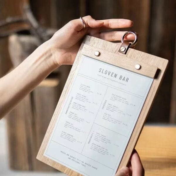 Rustic wood menu holder displaying Slovens Bar's drink menu. A vintage-style clipboard for restaurants and cafes.