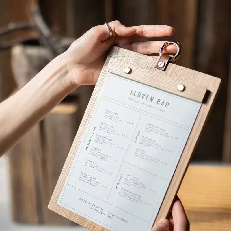 Rustic wood menu holder displaying Slovens Bar's drink menu. A vintage-style clipboard for restaurants and cafes.