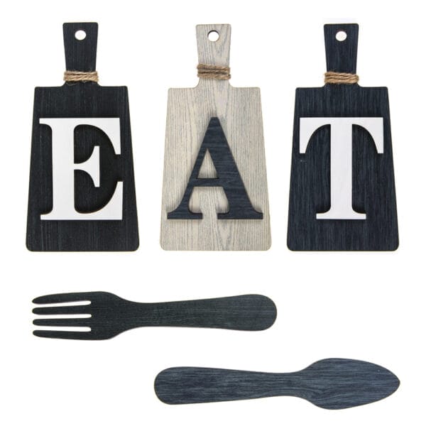 Three cutting boards with the EAT letter logo are arranged above black wooden cutouts of a fork & spoon set.