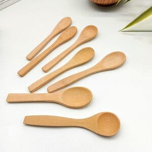Assortment of small, handcrafted wooden spoons. Ideal for wholesale and distribution by a wooden spoon manufacturer.