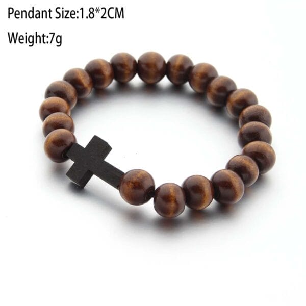 A wooden bead bracelet with a black cross pendant is displayed on a white background. Text indicates the pendant size as 1.8*2cm and weight as 7g.