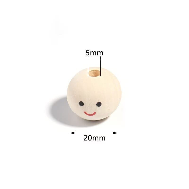 Wooden bead with a smiling face, 20mm in diameter and a 5mm hole through the center, placed on a white background.