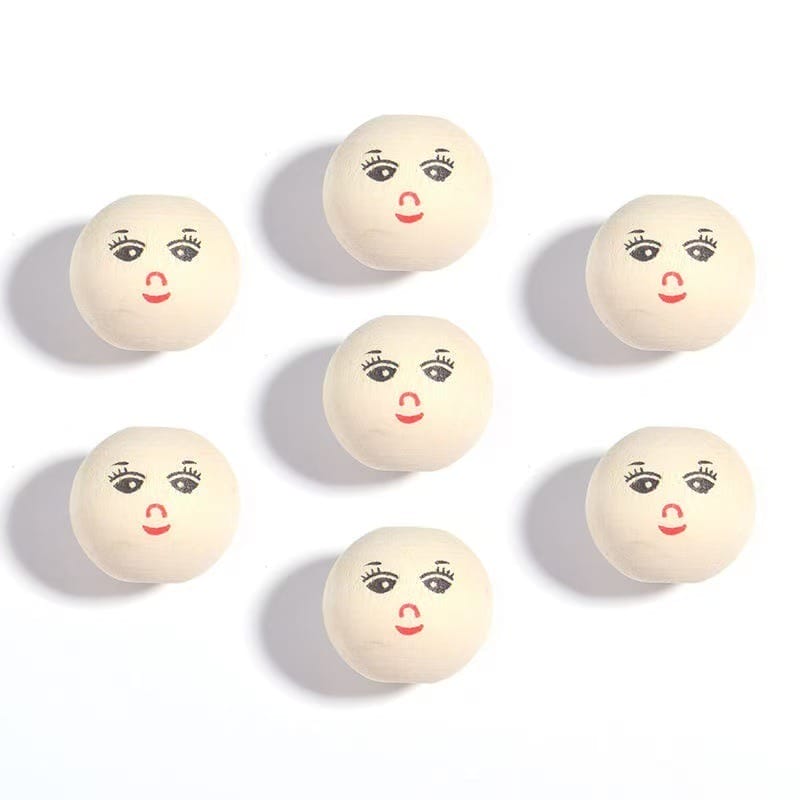 Seven white balls with simple cartoon faces, arranged in a circle on a white background.
