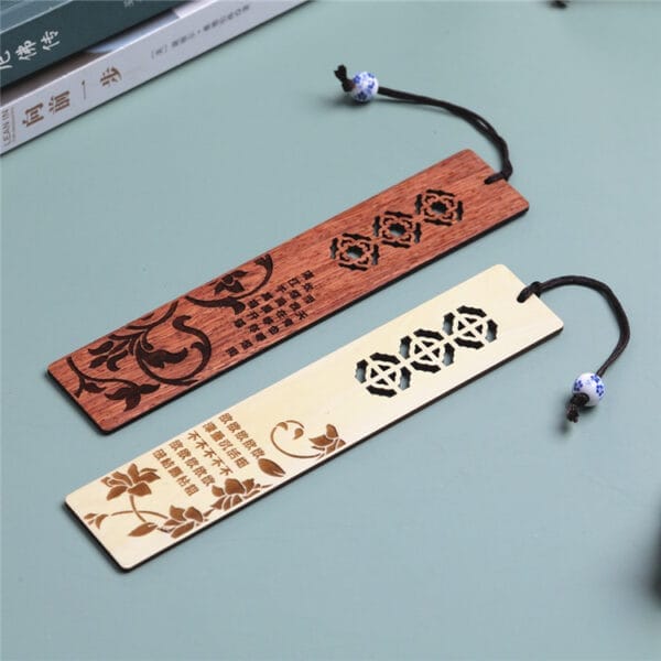 Elegant Chinese Style Wooden Bookmarks featuring intricate laser-engraved floral designs and Chinese text, each adorned with a string and decorative bead—perfect as unique laser engraved gifts.